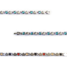 Close-up of Beloved bracelet showing blue Swarovski crystal heart links and polished steel hearts.