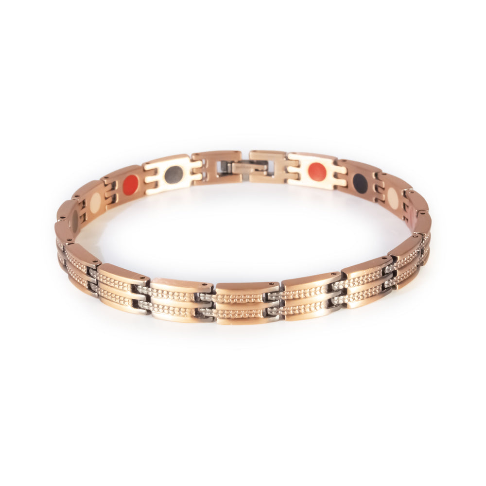 Canyon copper negative ion bracelet clasped front view, slim unisex design with etched bar pattern.