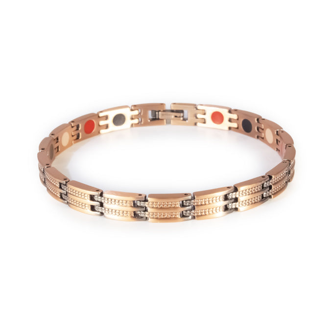 Canyon copper negative ion bracelet clasped front view, slim unisex design with etched bar pattern.