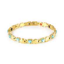 Celeste gold-plated stainless steel bracelet with blue crystals clasped front view, heart-link design.
