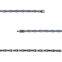 Close-up of Cobalt Blue bracelet showing royal blue crystals and interlocking black titanium links.