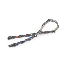 Cobalt Blue bracelet unclasped and folded to display black link design and blue crystal accents.