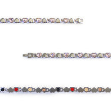 Close-up of Devotion bracelet showing pink Swarovski crystal heart links and polished steel hearts.