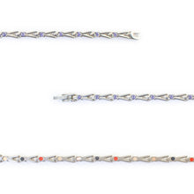 Close-up of Evermore bracelet showing purple crystals and slim interlocking titanium links.