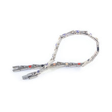Evermore bracelet unclasped and folded to display interlocking links and crystal accents.
