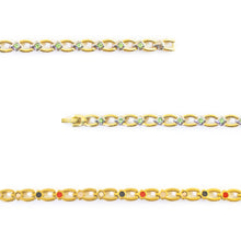 Close-up of Grandeur bracelet showing small green crystals set in polished titanium links.
