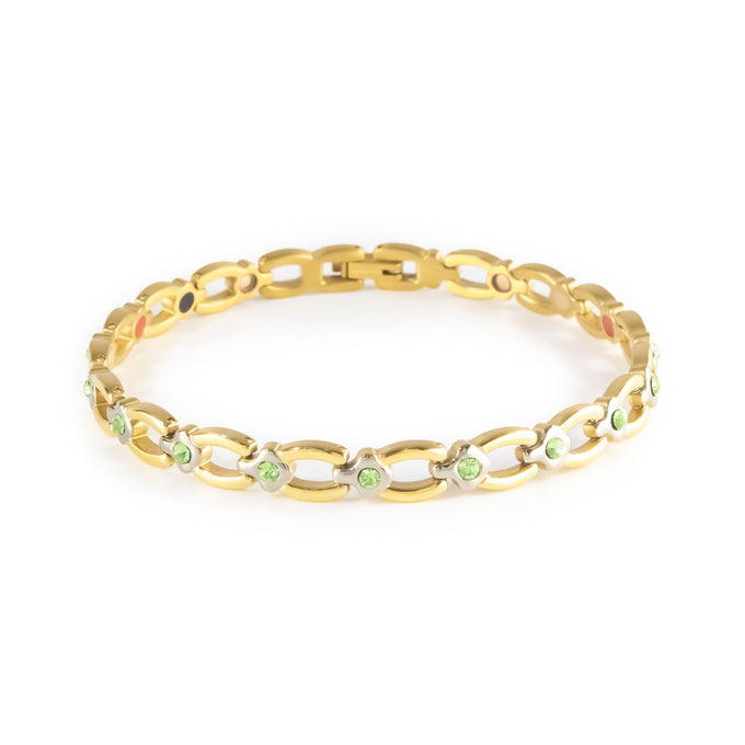 Grandeur gold-plated titanium bracelet with green crystal accents clasped front view.