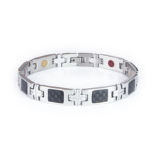 Impact stainless steel bracelet front view showing carbon fiber inlay links and cross-shaped spacer links with engraved lines.