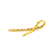 Luminosity gold bracelet unclasped, displaying polished and matte link contrast with embedded elements.