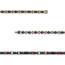 Close-up of Monarch negative ion bracelet links with matte black stainless steel and rose gold to show detail.