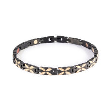 Monarch negative ion bracelet with matte black stainless steel and rose gold links, front clasped view. 