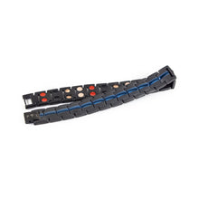 Ocean Night titanium bracelet unclasped and folded to display matte black finish, blue accents, and precision link construction.