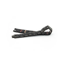 Pure Black matte stainless steel bracelet unclasped and folded to display link pattern and polished border detail.