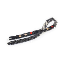 Strider negative ion bracelet with matte black stainless steel, unclasped and folded for display.