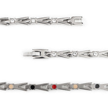 Close-up of Vibrant Spark bracelet highlighting titanium links, round crystals, and smooth polished finish.