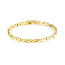 Vitalis gold-plated titanium bracelet with green crystals clasped front view.